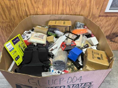 A box of electronics and other items in it.