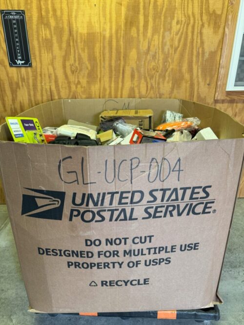 A box of food is sitting in front of the door.