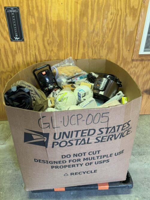 A box of mail and cell phones sitting on the floor.